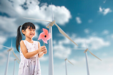 Asian girl Play windmill on wind turbine  background  for World Ozone Day concept