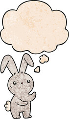 cute cartoon rabbit and thought bubble in grunge texture pattern style