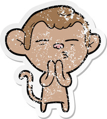 distressed sticker of a cartoon suspicious monkey
