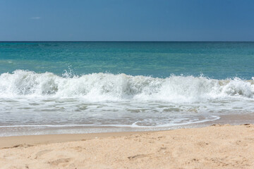Waves crashing on the seashore. Blue sea. Foamy waves. waves for surfing tropical beach

