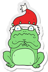 sticker of a cartoon frog in christmas hat