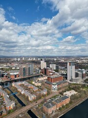 Fototapeta na wymiar Aerial view of Salford Quays with river views and modern buildings. 
