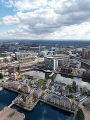 Fototapeta na wymiar Aerial view of Salford Quays with river views and modern buildings. 