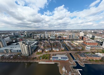 Obraz premium Aerial view of Salford Quays with river views and modern buildings. 