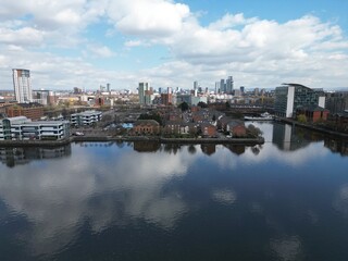 Fototapeta na wymiar Aerial of Salford Quays with views towards Manchester city centre and modern skyscrapers. 