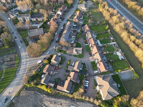 aerial view of a residential neighbourhood with houses and roads. 