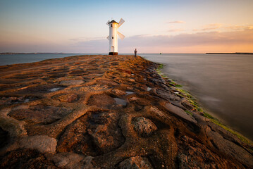 Lighthouse windmill Stawa Mlyny, Swinoujscie, Baltic Sea - Poland - 586610561