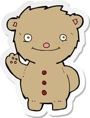 sticker of a cartoon waving teddy bear