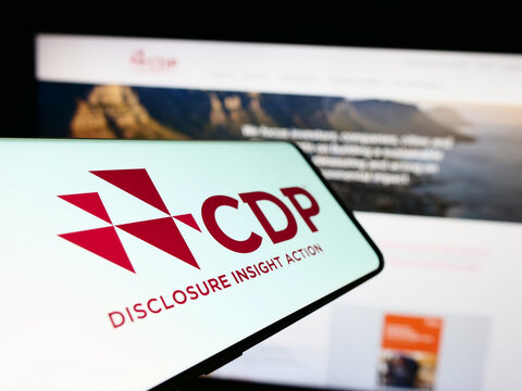 Stuttgart, Germany - 03-25-2023: Smartphone with logo of organization Carbon Disclosure Project (CDP) on screen in front of website. Focus on center-left of phone display.