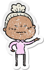 distressed sticker of a cartoon annoyed old lady