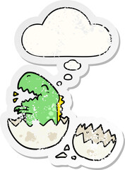 cartoon dinosaur hatching and thought bubble as a distressed worn sticker
