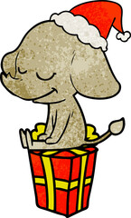 textured cartoon of a smiling elephant wearing santa hat