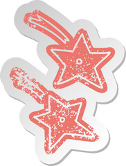 distressed old sticker of ninja throwing stars