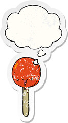 cartoon candy lollipop and thought bubble as a distressed worn sticker