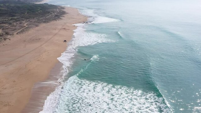 Waves breaking on the shore of the sandy beach of Mangueta in Zahora town, south Spain.