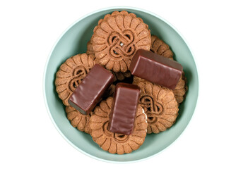Cookies and sweets on a plate on a white background.