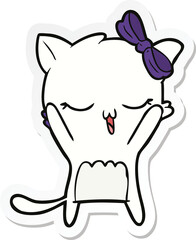 sticker of a cartoon cat with bow on head