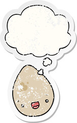 cartoon egg and thought bubble as a distressed worn sticker