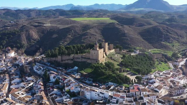 Aerial drone footage of the castle of Antequera with Spanish medieval and moorish town in Andalusia