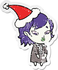 cute distressed sticker cartoon of a vampire girl wearing santa hat