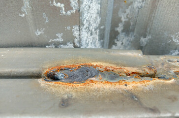 Steel welds are rusty, deteriorated, corroded.