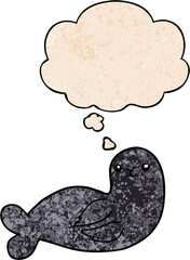 cartoon seal and thought bubble in grunge texture pattern style