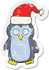 retro distressed sticker of a cartoon christmas penguin