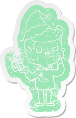 cartoon distressed sticker of a man wondering wearing santa hat