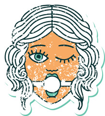 distressed sticker tattoo style icon of winking female face with ball gag