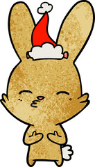 curious bunny textured cartoon of a wearing santa hat
