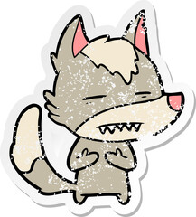 distressed sticker of a cartoon wolf showing teeth