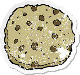 retro distressed sticker of a chocolate chip cookie cartoon
