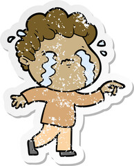 distressed sticker of a cartoon man crying