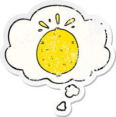 cartoon lemon and thought bubble as a distressed worn sticker
