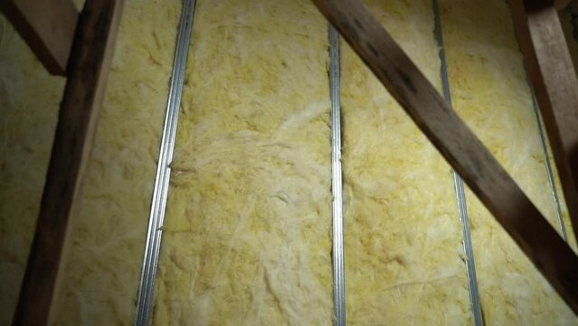 Wall made of metal U profile with glass wool, smooth camera movement