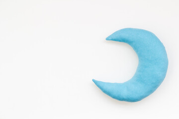 Soft pillow in shape of moon. Bedding for good sleep and rest