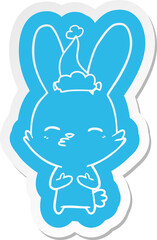 curious bunny cartoon  sticker of a wearing santa hat