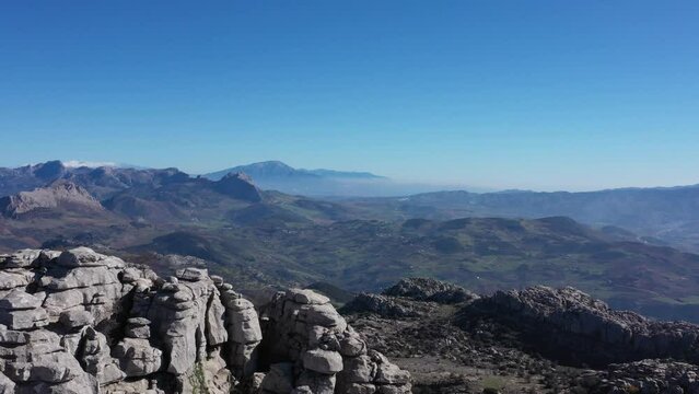 Impressive Mountain top rocks in Torcal de Antequera seen from above, aerial drone view of karstik rocks in Spain