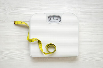 Weight scale and tape measure top view. Weight control concept