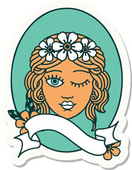 tattoo sticker with banner of a maiden with crown of flowers winking