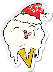 distressed sticker cartoon of a melting ice cream wearing santa hat