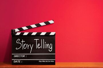 Storytelling, handwritten text title on film slate or movie clapper board and vision sharing...