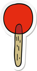 sticker of a cartoon candy lollipop