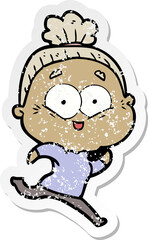 distressed sticker of a cartoon happy old woman
