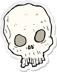 sticker of a cartoon spooky skull