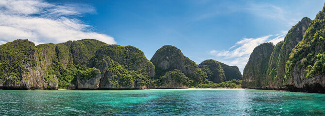 Tropical islands view with ocean blue sea water and white sand beach at Maya Bay of Phi Phi Islands, Krabi Thailand nature landscape panorama