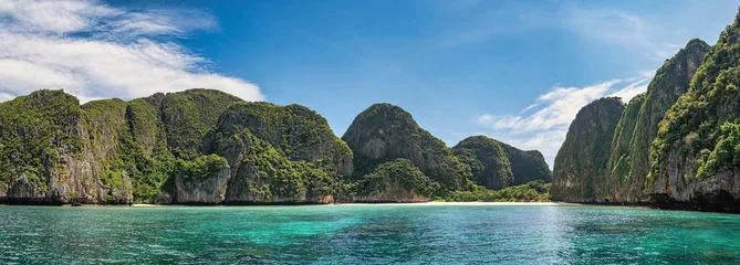 Deurstickers Tropical islands view with ocean blue sea water and white sand beach at Maya Bay of Phi Phi Islands, Krabi Thailand nature landscape panorama © Noppasinw