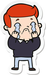 sticker of a cartoon man crying