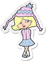 sticker of a cartoon happy girl wearing hat