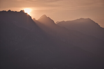 Mountain silhouette in the morning mist Saalfelden, Salzburg, Austria